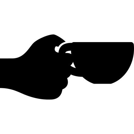 Hand holding up a cup of coffee
