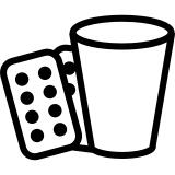 Medicine tablets and a glass