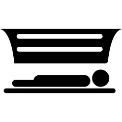 Person lying in an artificial solar tan bed for indoor bronze skin tone