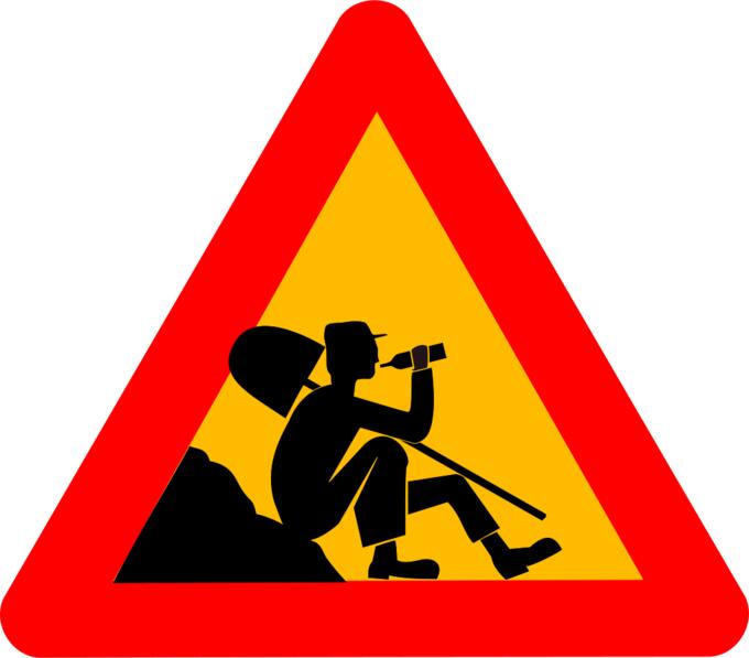 Vector clip art of man at work warning sign