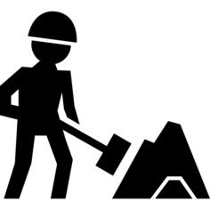 Worker of construction working with a shovel beside material pile