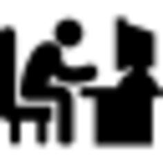 Man typing on computer desk
