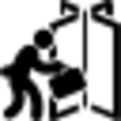 Businessman with suitcase entering by a rotatory door
