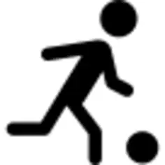Soccer player running behind the ball