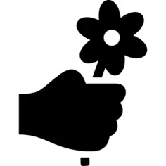 Hand holding up a flower