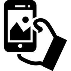 Hand holding cellphone to take a selfie