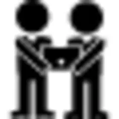 Two males holding a computer