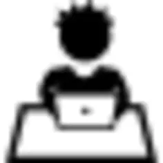 Student boy sitting studying with a computer on a table