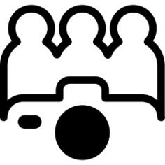 People posing in front of a camera