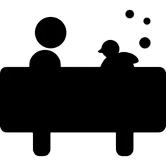 Boy in bath with a duck